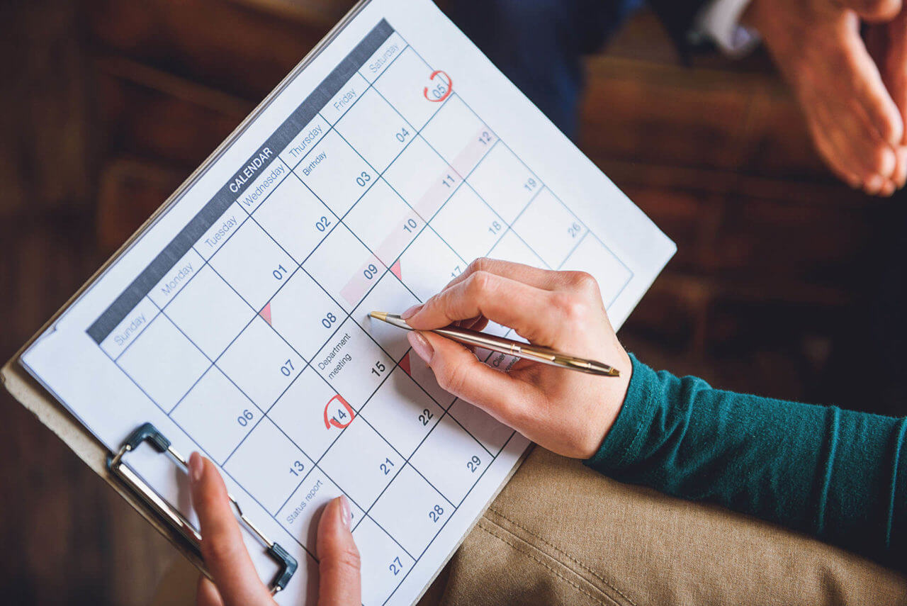 person checking moving date on calendar