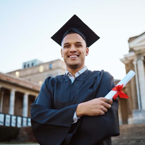 University, graduation and happy man with a diploma scroll standing outdoor of his campus. Education, scholarship and male graduate from Mexico with academic certificate or degree for college success.