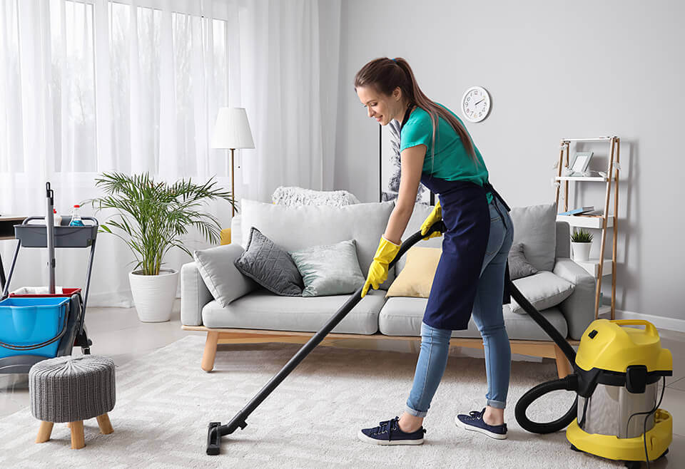 woman vacuuming new apartment