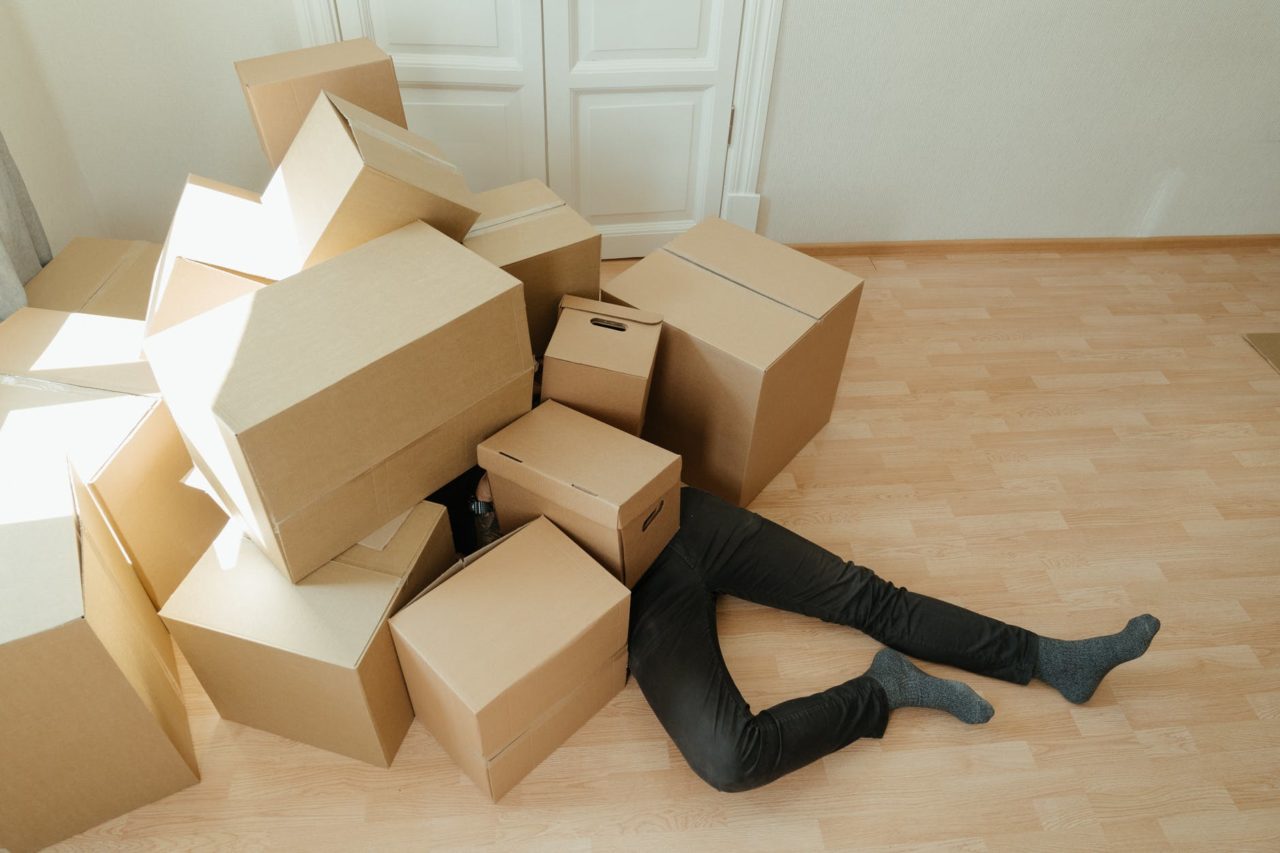 A person under boxes