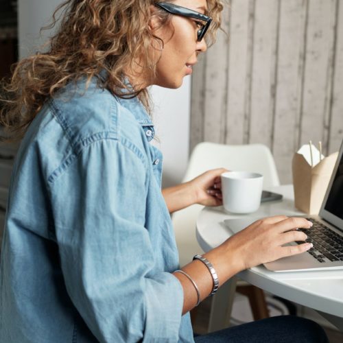 A woman having a video call on the laptop after cross-country moving