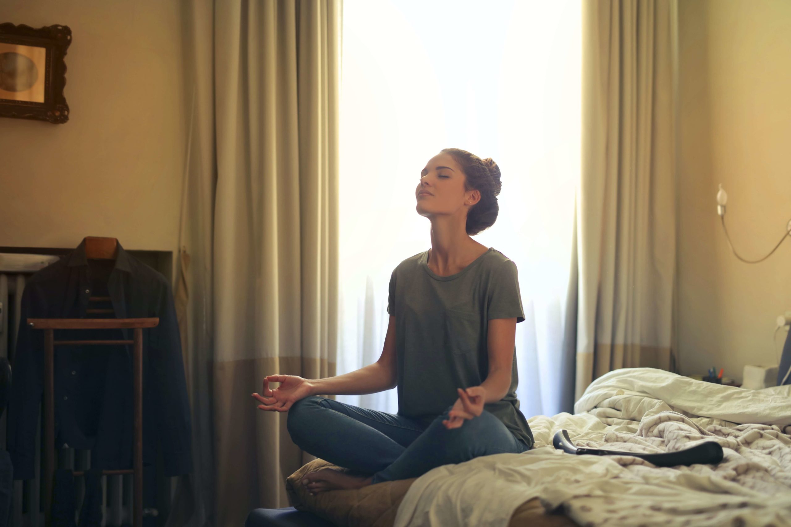 woman-meditating-in-bedroom