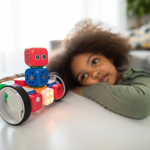 kid looking at a toy