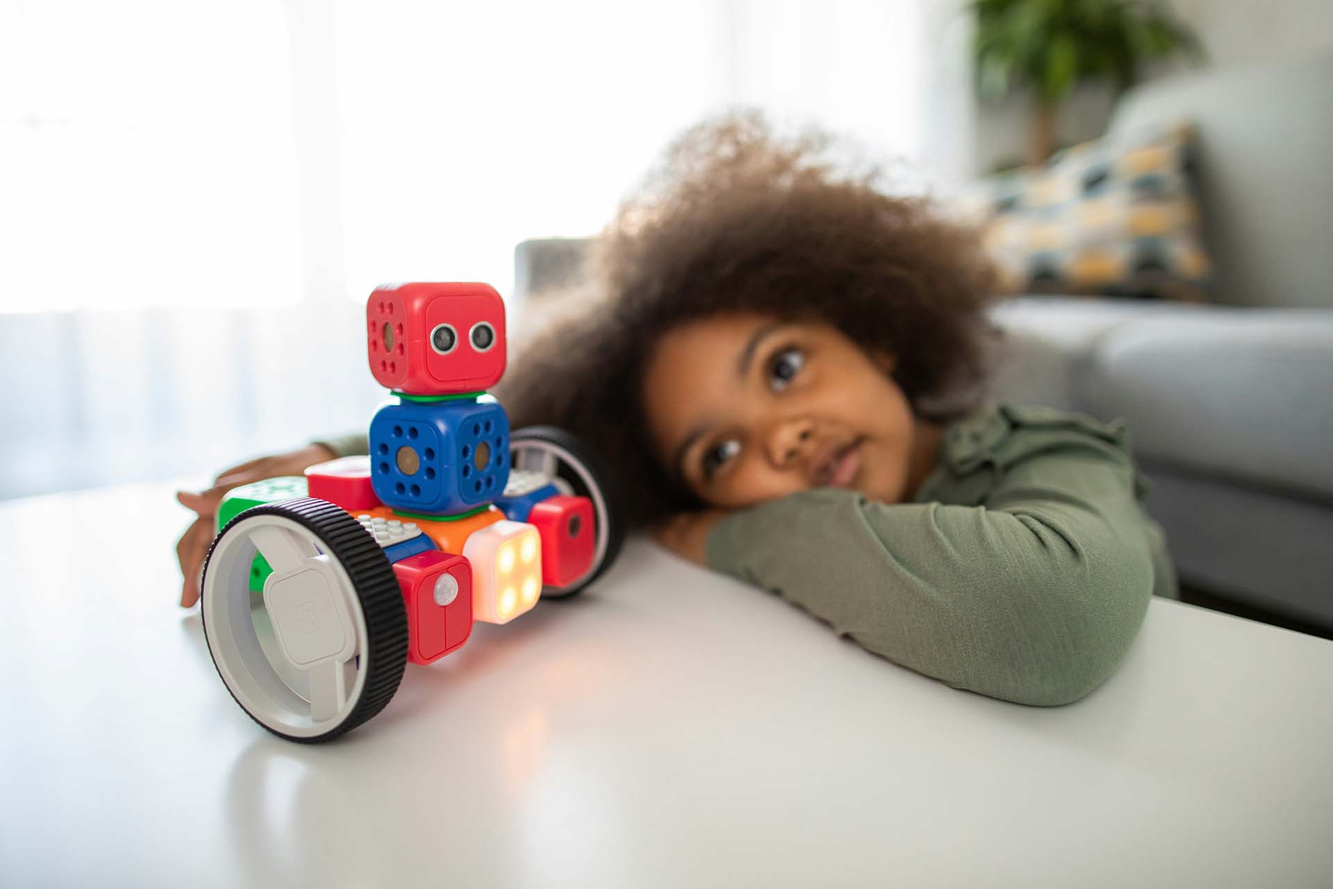 kid looking at a toy