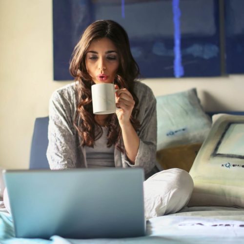 woman-sits-on-bed