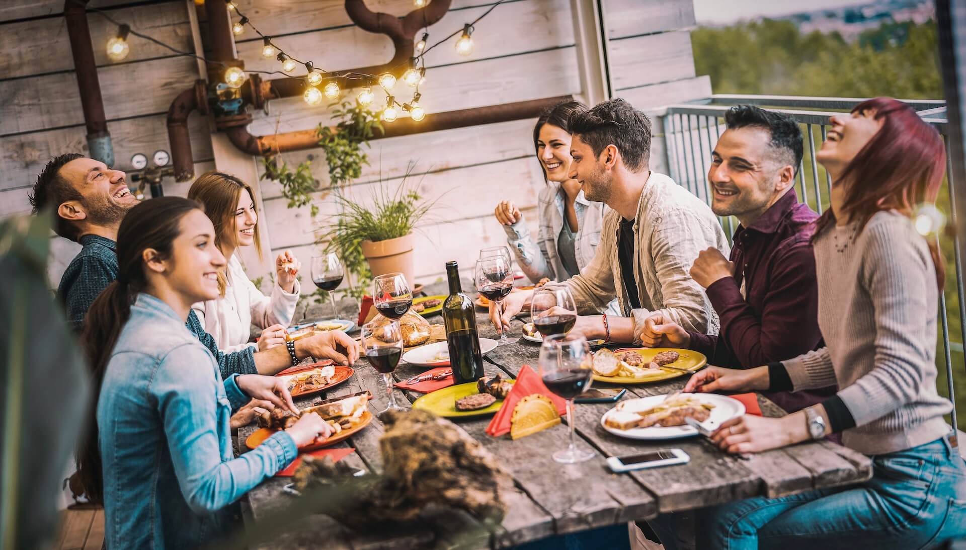 Friends sitting at a table and laughing