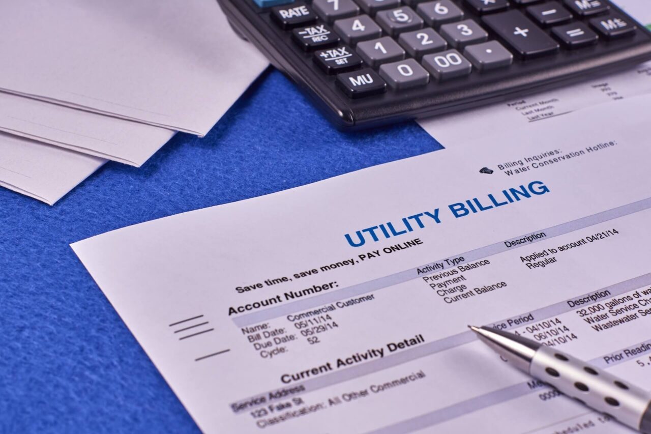 Utility bill next to a calculator